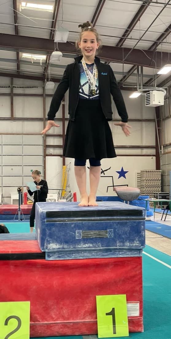 A gymnast on the podium